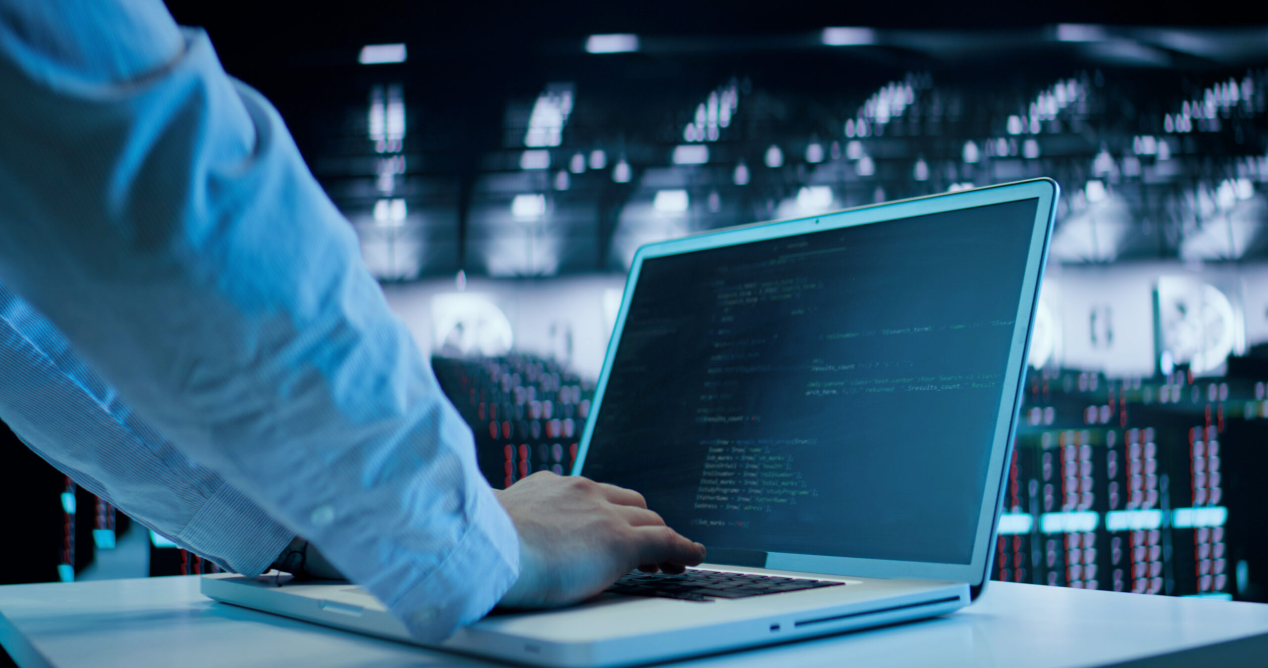 Caucasian Man, IT Technician Using Laptop, Doing Maintenance and Diagnostics in the Server Room. Cloud Storage Technology, Database, Engineering SAPHIR Cimetières