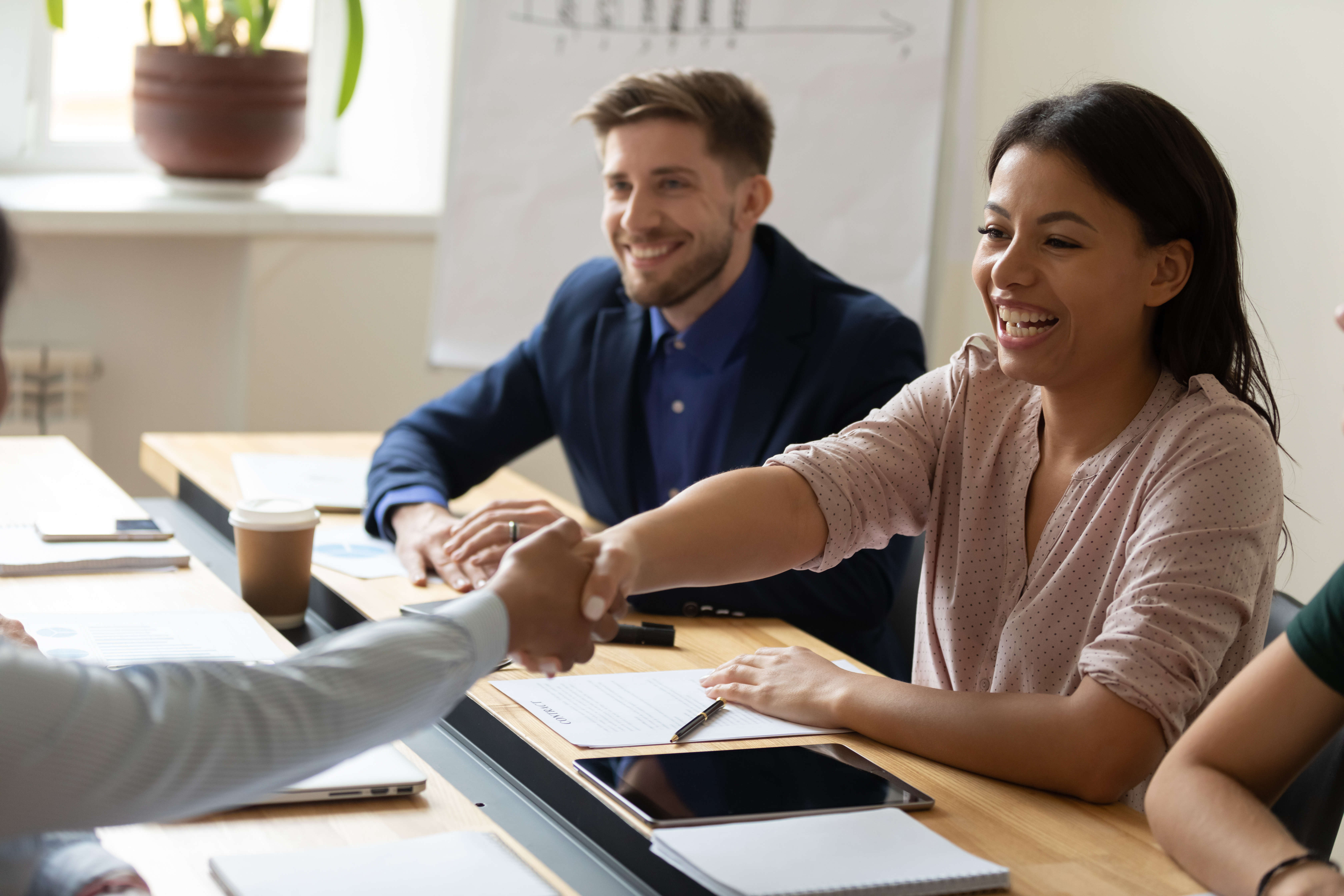 Happy laugh hr african american businesswoman shaking hand of applicant. SAPHIR Cimetières